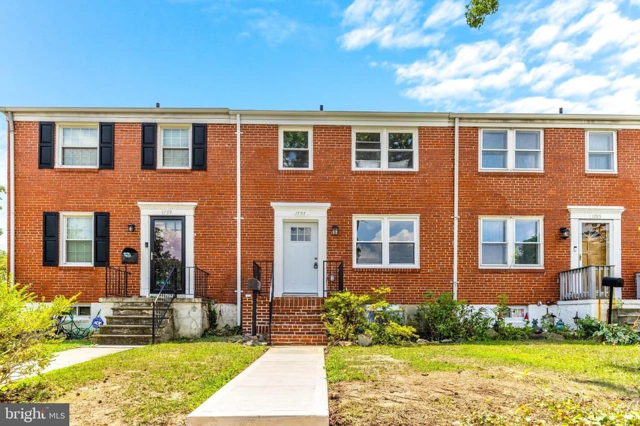 1797 Joan Avenue, the central brick home in the pictured row