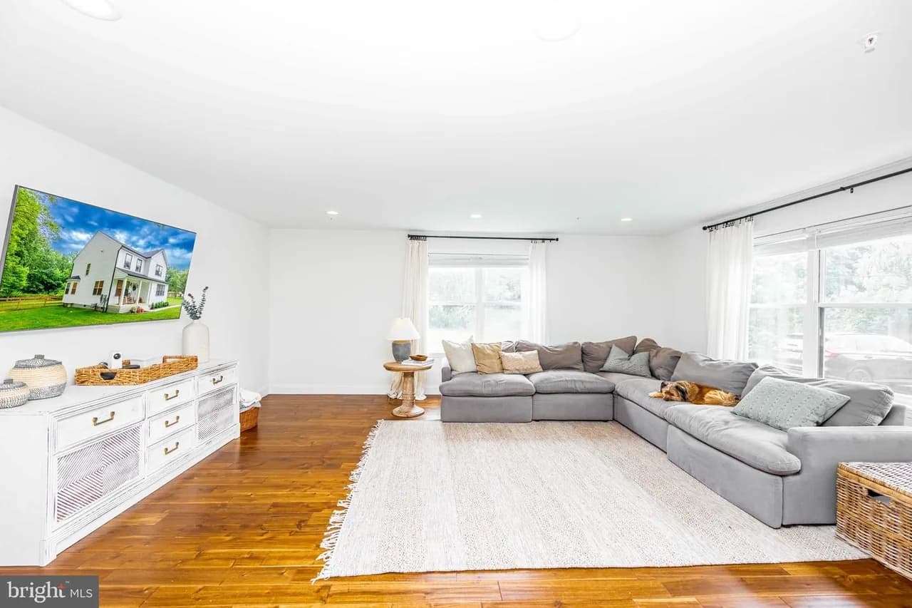 Living room at Glenwood with warm wood-look flooring
