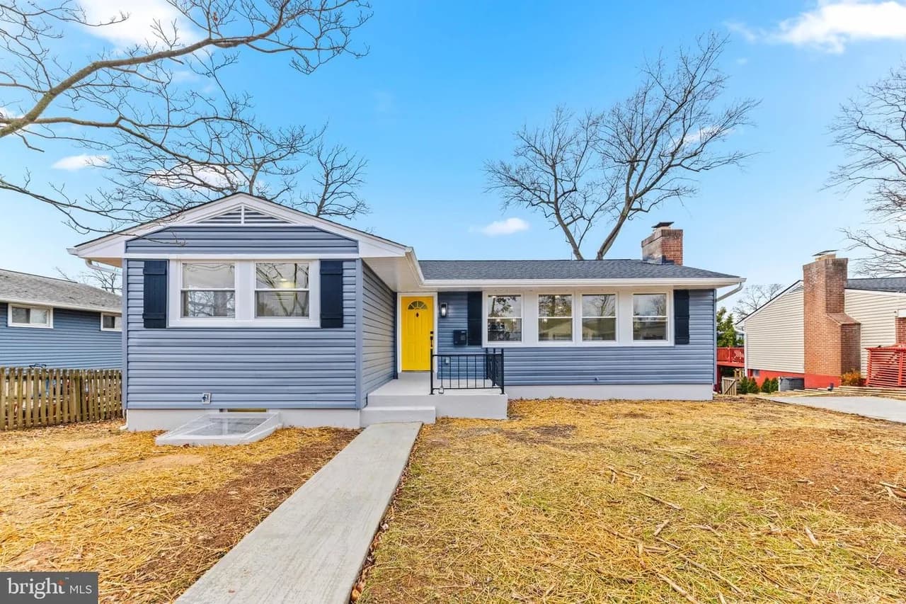Blue-grey rancher at 4 Bramleigh Road with a yellow front door