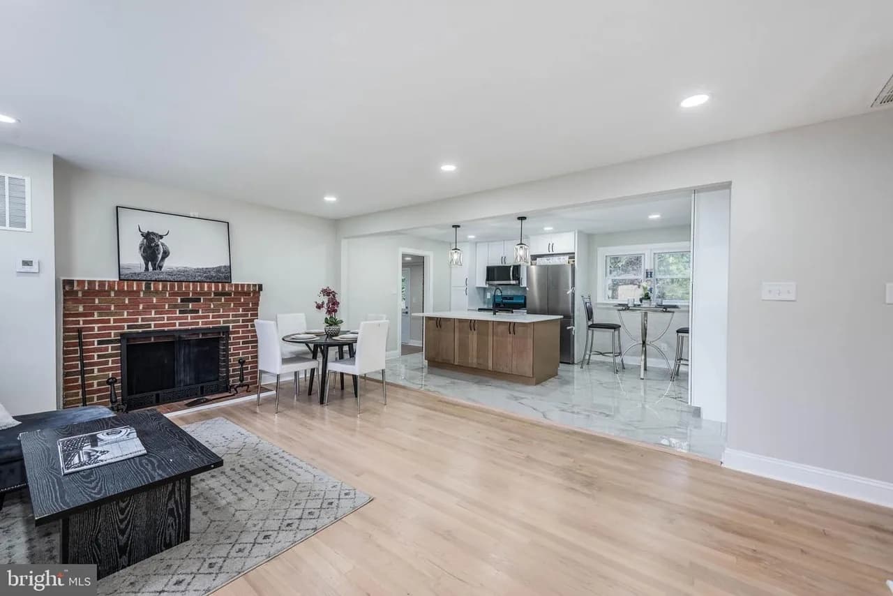 Beavers Court living room with a brick fireplace and kitchen connection