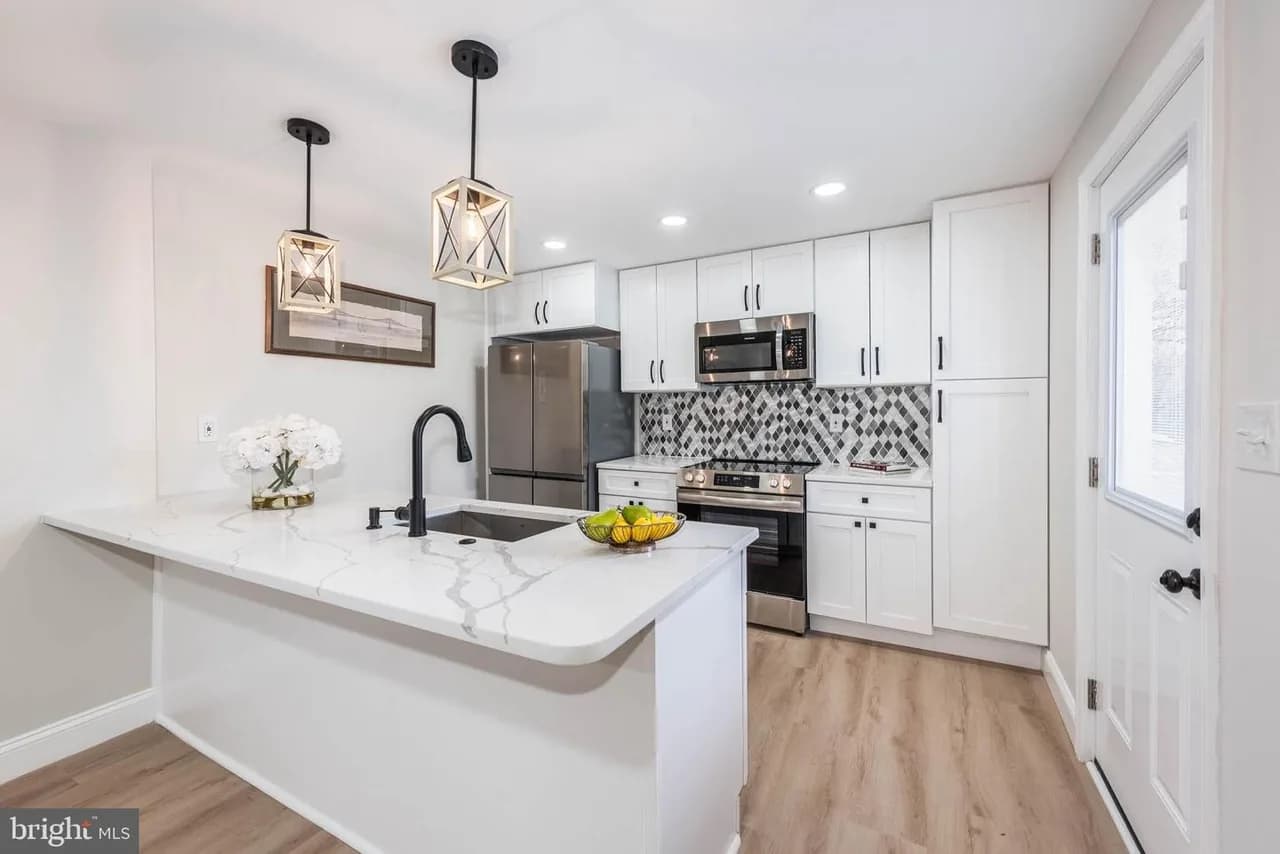 Walters Mill kitchen with an island, pendants and patterned backsplash